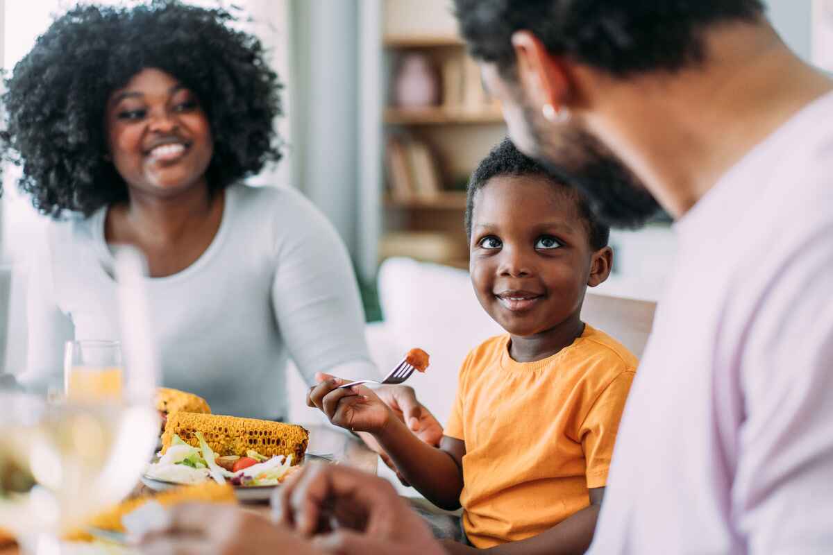 Family eats a meal together