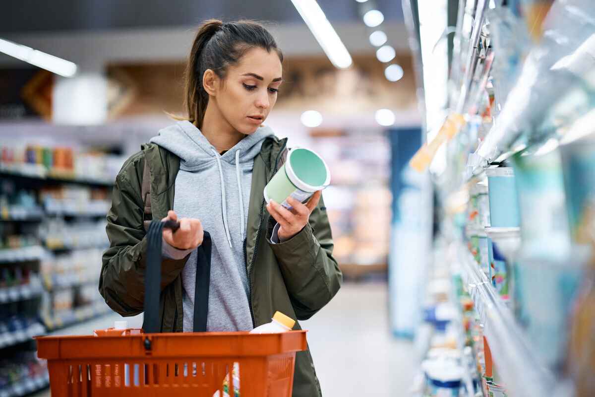 Woman reads nutrition label