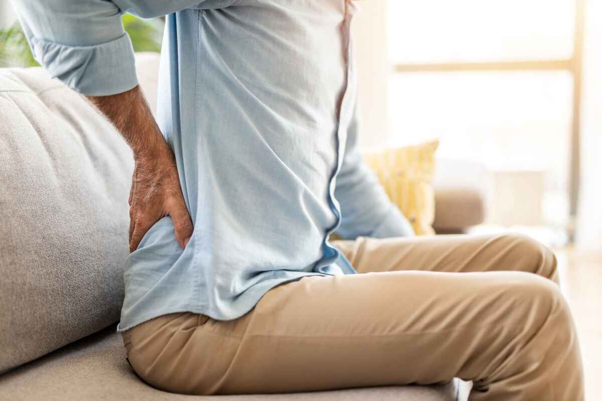 Man experiences lower back pain